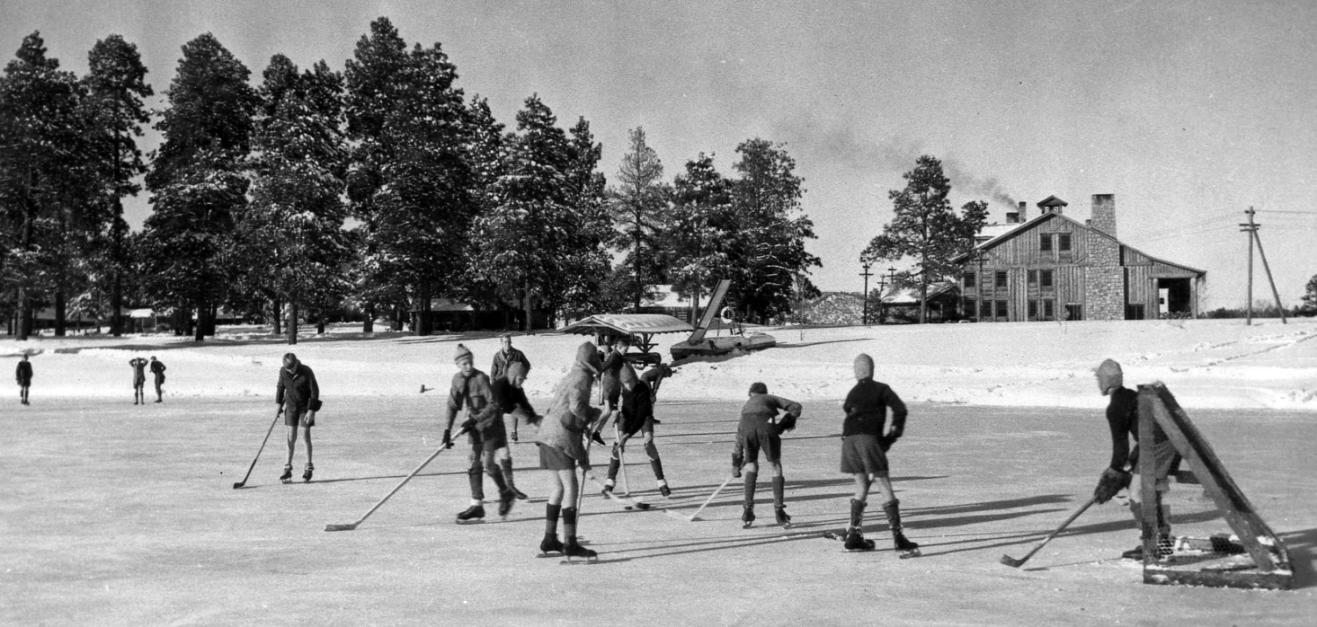 Los Alamos Ranch School boys playing hockey on Ashley Pond, 1924.